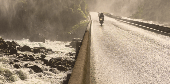 switch to synergy - motorcyclist on bridge